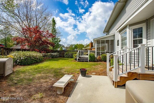 138 Stonebridge Trl, Havelock, NC 28532 - view of yard featuring a sunroom and a fenced backyard