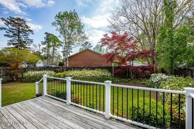 138 Stonebridge Trl, Havelock, NC 28532 - wooden deck with a fenced backyard and a lawn