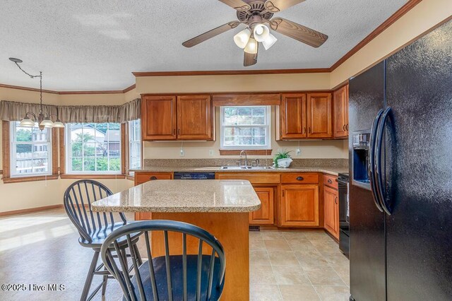 138 Stonebridge Trl, Havelock, NC 28532 - kitchen with a wealth of natural light, a textured ceiling, and black appliances