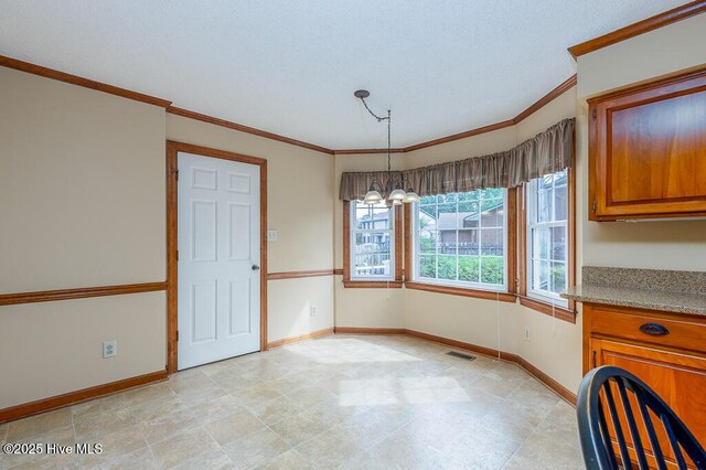 138 Stonebridge Trl, Havelock, NC 28532 - unfurnished dining area with crown molding, a notable chandelier, baseboards, and visible vents