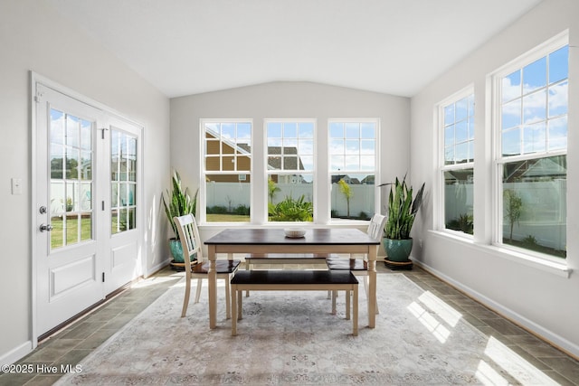 sunroom / solarium featuring french doors