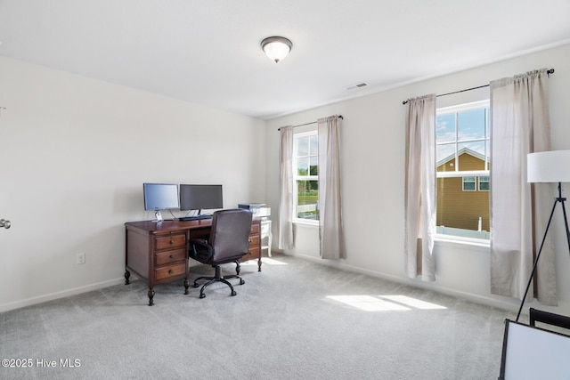 office featuring baseboards, visible vents, and carpet floors