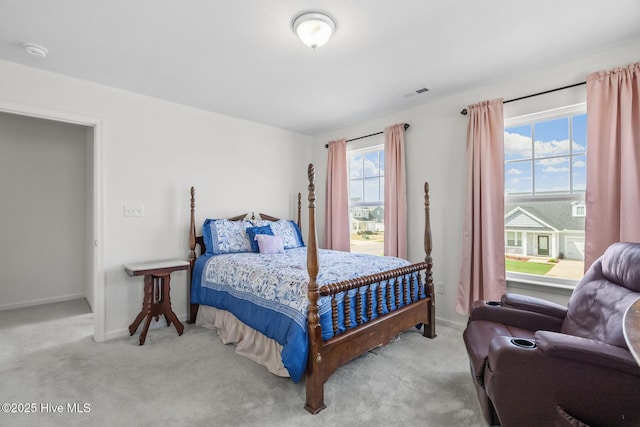 bedroom with baseboards, visible vents, and carpet floors