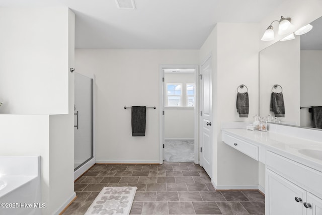 full bath featuring a garden tub, a shower stall, vanity, visible vents, and baseboards