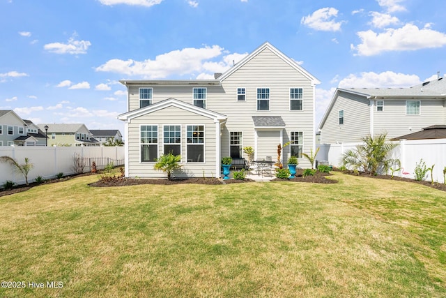 rear view of property with a fenced backyard, a patio area, and a lawn
