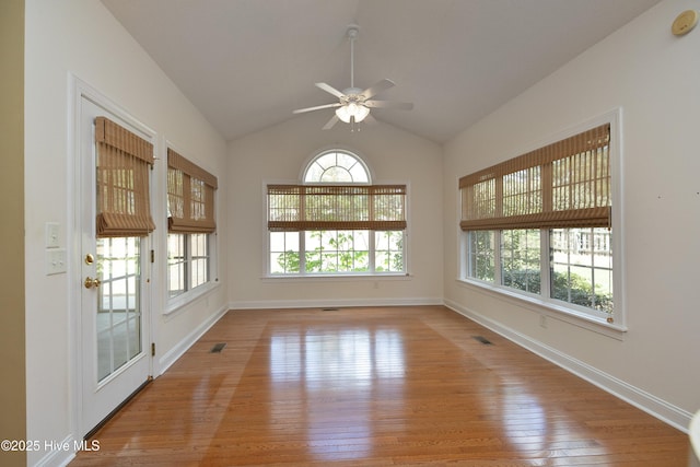 995 Monticello Dr, Pinehurst, NC 28374 - spare room with hardwood / wood-style floors, ceiling fan, baseboards, and vaulted ceiling