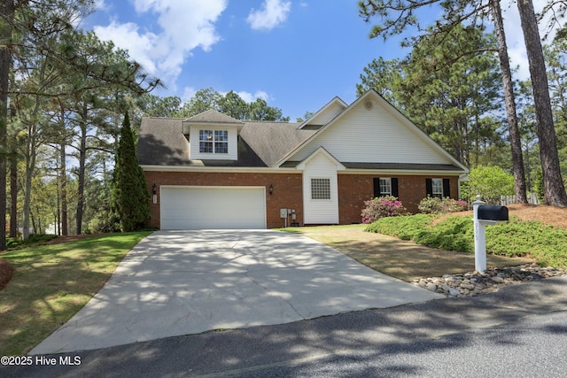 995 Monticello Dr, Pinehurst, NC 28374 - view of front facade featuring brick siding and driveway