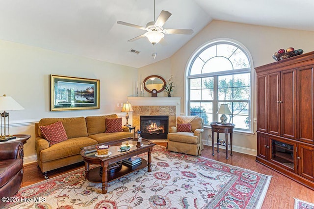 105 W Chelsea Ct, Southern Pines, NC 28387 - living room with a healthy amount of sunlight, ceiling fan, a fireplace, and visible vents