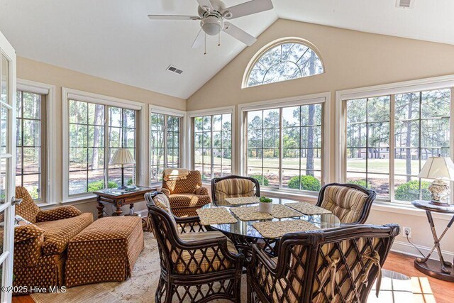 105 W Chelsea Ct, Southern Pines, NC 28387 - sunroom featuring wood finished floors, high vaulted ceiling, visible vents, and plenty of natural light