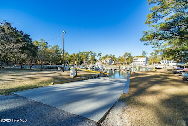 view of home's community featuring a dock