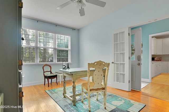 161 N Lake Dr, Boiling Spring Lakes, NC 28461 - dining space featuring baseboards, a ceiling fan, and light wood-style flooring