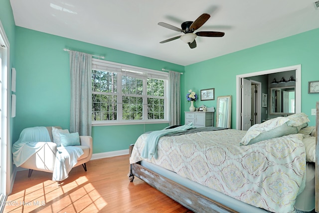 161 N Lake Dr, Boiling Spring Lakes, NC 28461 - bedroom with baseboards, ceiling fan, wood finished floors, and visible vents