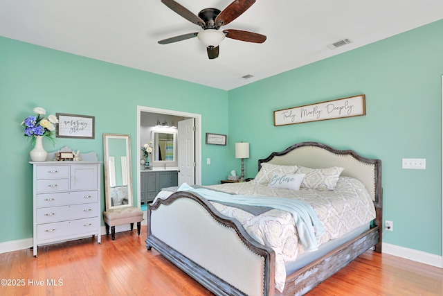 161 N Lake Dr, Boiling Spring Lakes, NC 28461 - bedroom with visible vents, baseboards, and wood finished floors