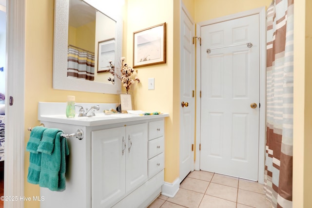 161 N Lake Dr, Boiling Spring Lakes, NC 28461 - bathroom featuring tile patterned flooring, baseboards, and vanity