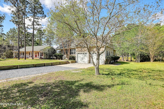 161 N Lake Dr, Boiling Spring Lakes, NC 28461 - ranch-style house with driveway and a front yard