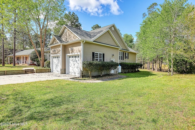 161 N Lake Dr, Boiling Spring Lakes, NC 28461 - view of home's exterior with a lawn, an attached garage, concrete driveway, and a shingled roof