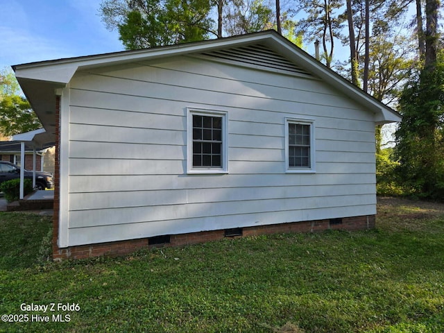 view of property exterior featuring a lawn and crawl space