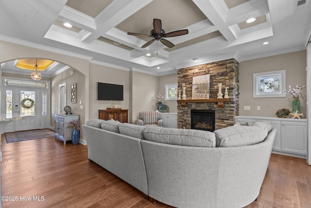 8549 Oak Abbey Trl NE, Leland, NC 28451 - living area with a ceiling fan, arched walkways, coffered ceiling, and crown molding