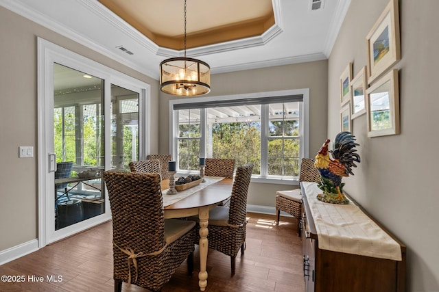 8549 Oak Abbey Trl NE, Leland, NC 28451 - dining area featuring visible vents, baseboards, a chandelier, and dark wood finished floors