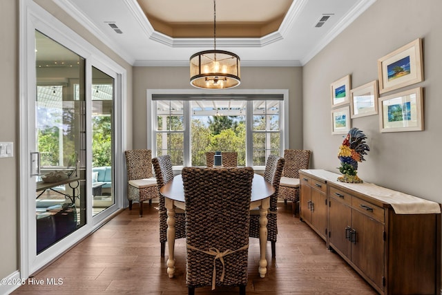 8549 Oak Abbey Trl NE, Leland, NC 28451 - dining room with a raised ceiling, visible vents, light wood finished floors, and an inviting chandelier