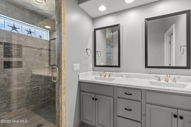 8549 Oak Abbey Trl NE, Leland, NC 28451 - bathroom featuring double vanity, a stall shower, and a sink