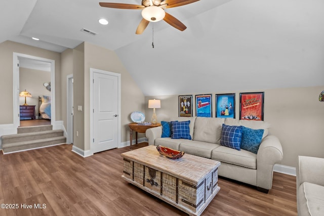 8549 Oak Abbey Trl NE, Leland, NC 28451 - living area with vaulted ceiling, visible vents, wood finished floors, baseboards, and ceiling fan
