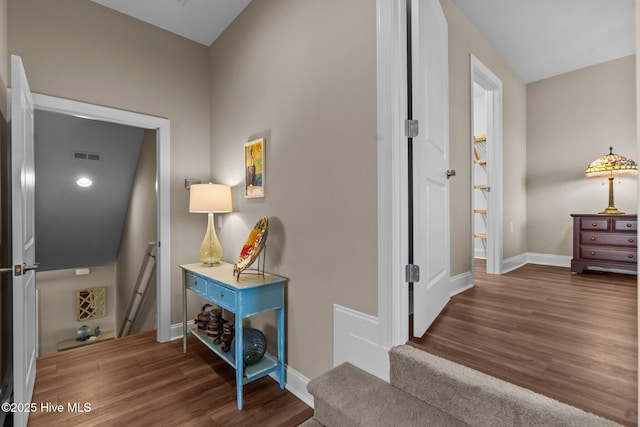 8549 Oak Abbey Trl NE, Leland, NC 28451 - hallway featuring visible vents, baseboards, and wood finished floors
