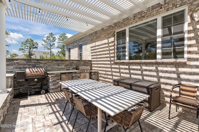 8549 Oak Abbey Trl NE, Leland, NC 28451 - view of patio featuring outdoor dining area, a pergola, and area for grilling