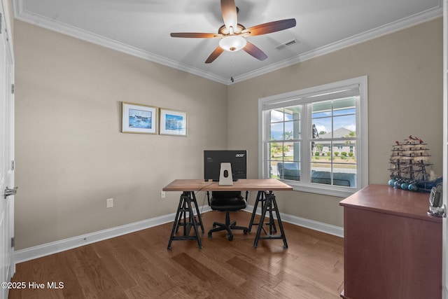 8549 Oak Abbey Trl NE, Leland, NC 28451 - home office with baseboards, visible vents, a ceiling fan, wood finished floors, and crown molding