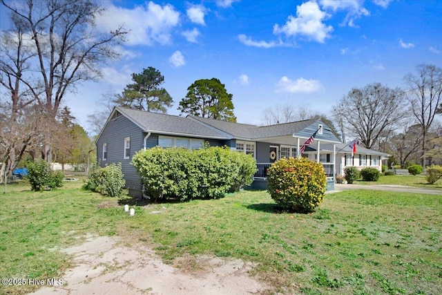 view of front of house with a front yard and driveway