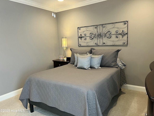 carpeted bedroom featuring baseboards and crown molding