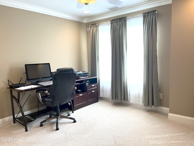 office space with light colored carpet, ornamental molding, and baseboards