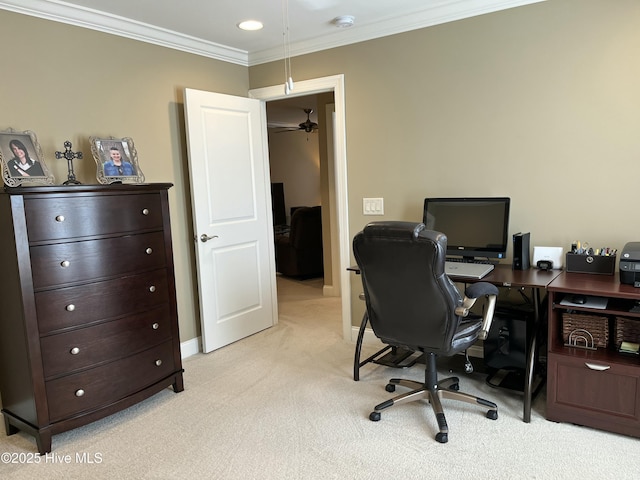 home office with crown molding, baseboards, and light colored carpet