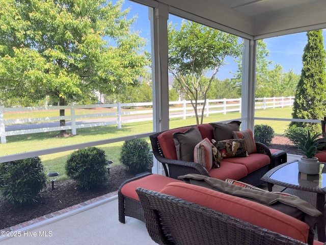 sunroom featuring outdoor lounge area