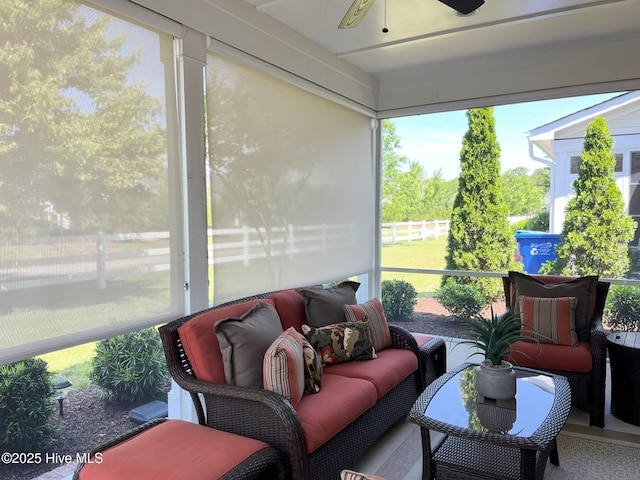 sunroom / solarium with ceiling fan and a healthy amount of sunlight