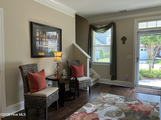 living area with crown molding, visible vents, stairs, baseboards, and dark wood-style floors