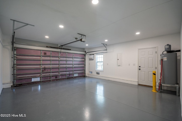 garage featuring electric panel, water heater, recessed lighting, a garage door opener, and baseboards