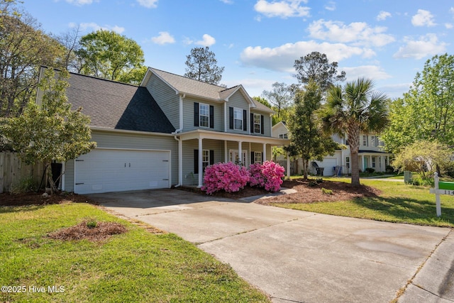 view of front of property with covered porch, a garage, concrete driveway, a front lawn, and roof with shingles