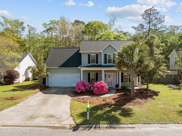 view of front facade featuring driveway, a front lawn, an attached garage, a porch, and fence
