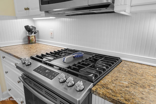 interior space with light countertops, white cabinetry, and stainless steel appliances