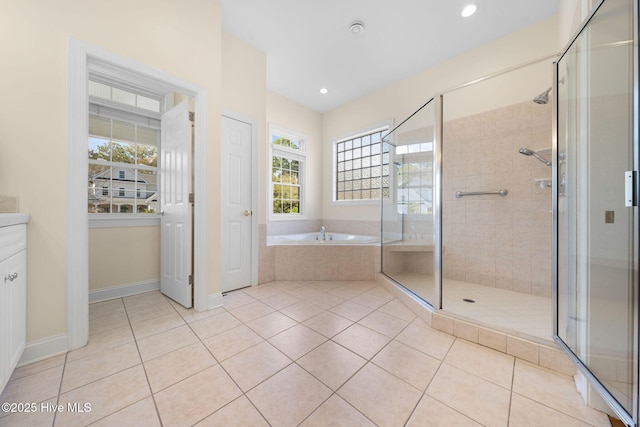 full bath with a bath, baseboards, tile patterned flooring, and a stall shower