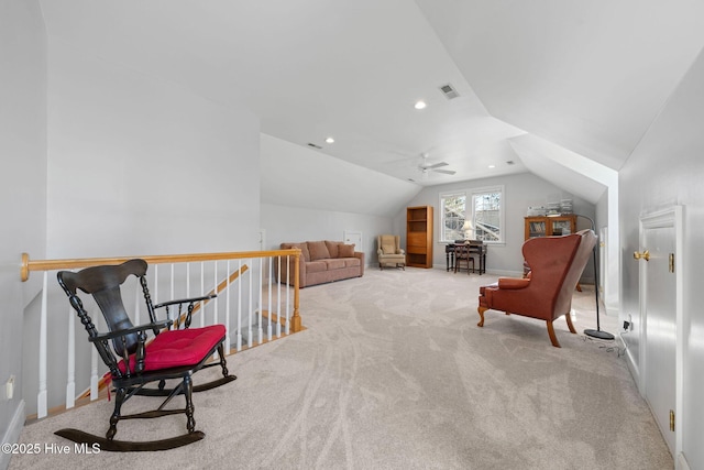 sitting room featuring visible vents, an upstairs landing, recessed lighting, carpet flooring, and lofted ceiling