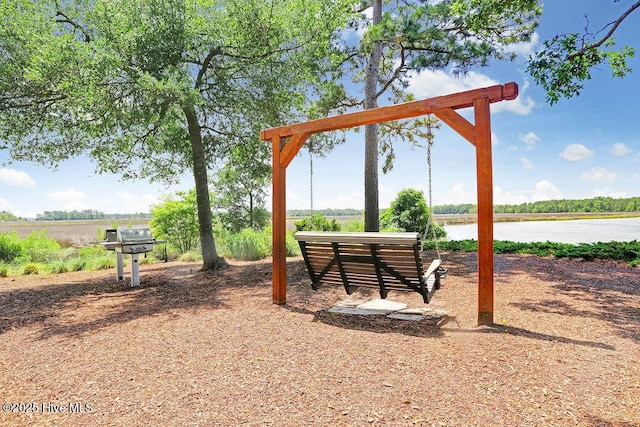 view of playground with a water view