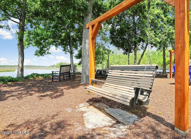 view of community with a water view