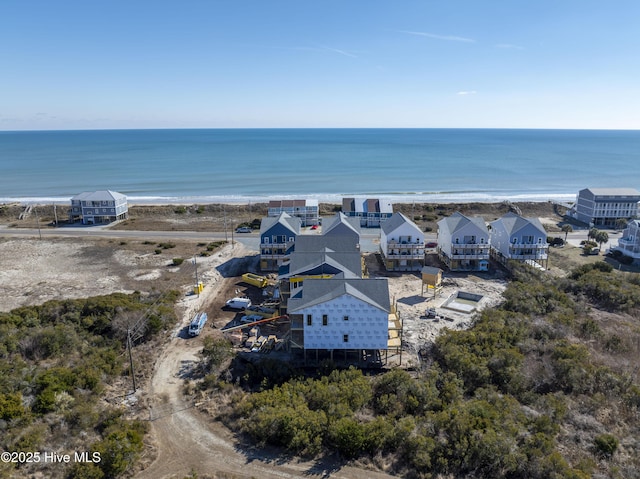 birds eye view of property featuring a view of the beach and a water view