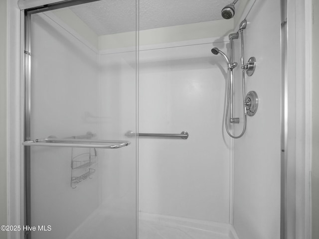 2000 New River Inlet Rd Unit 3513, North Topsail Beach, NC 28460 - full bathroom featuring a shower stall and a textured ceiling