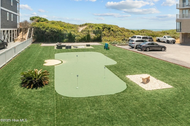 2000 New River Inlet Rd Unit 3513, North Topsail Beach, NC 28460 - view of property's community with uncovered parking, fence, and a lawn