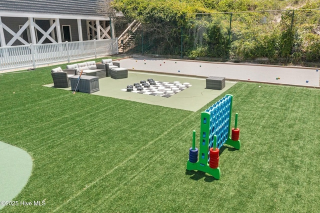 2000 New River Inlet Rd Unit 3513, North Topsail Beach, NC 28460 - view of community featuring a yard, an outdoor living space, and fence