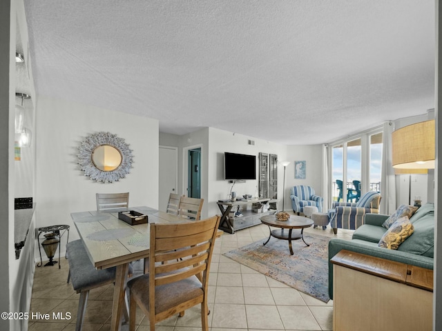2000 New River Inlet Rd Unit 3513, North Topsail Beach, NC 28460 - living area with a textured ceiling, light tile patterned floors, and visible vents