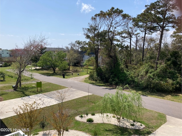 surrounding community featuring a yard